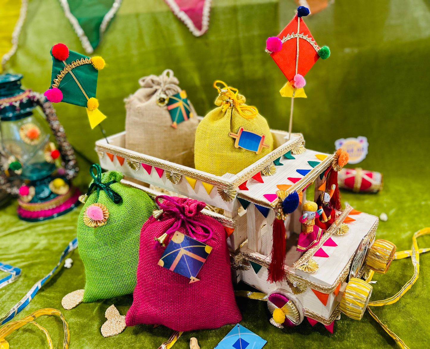Unique Lohri Hamper in a Decorated Truck-Shaped Basket with Gajak, Revdi, Moongfali, Til Gajak & Instant Popcorn
