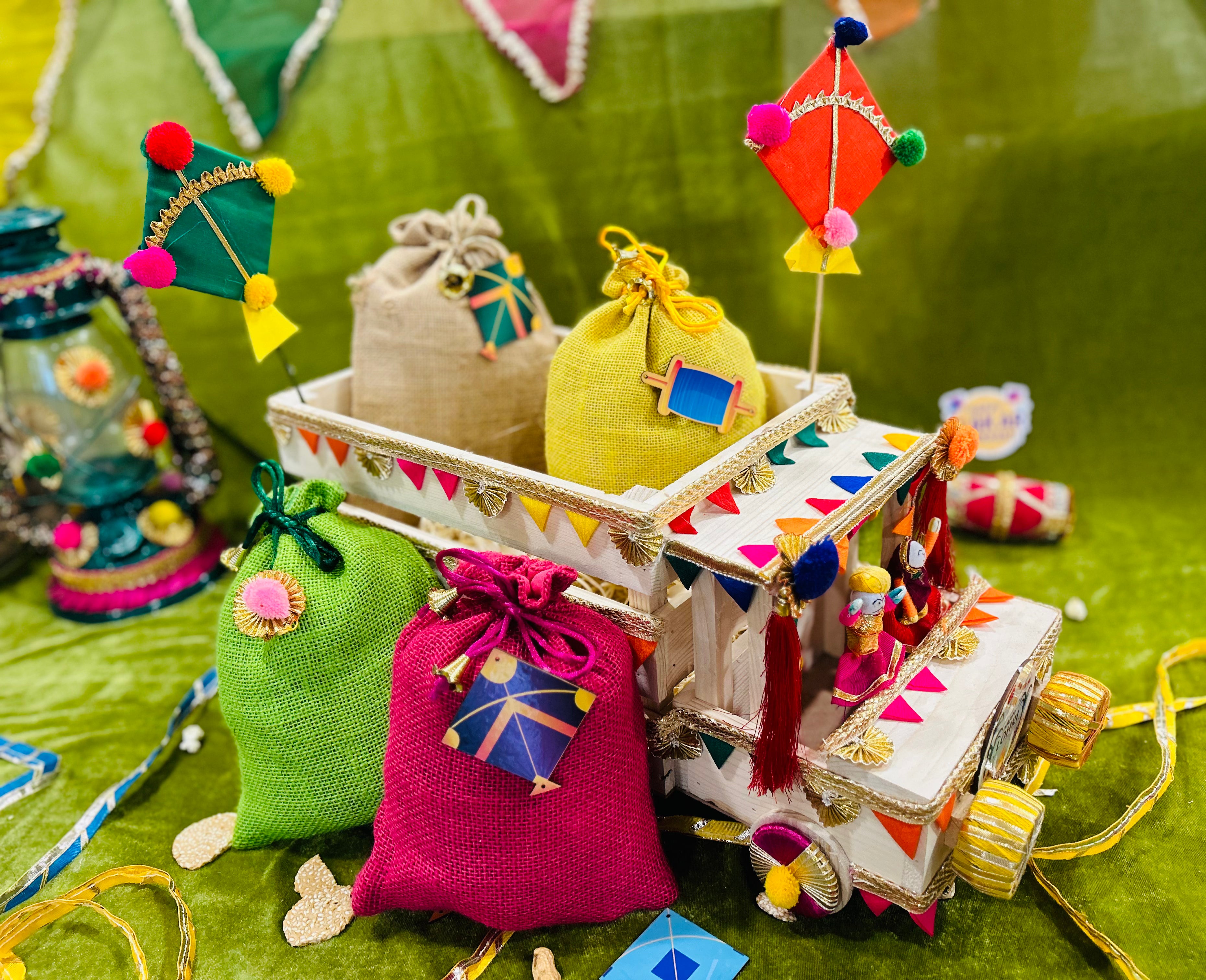 Unique Lohri Hamper in a Decorated Truck-Shaped Basket with Gajak, Revdi, Moongfali, Til Gajak & Instant Popcorn