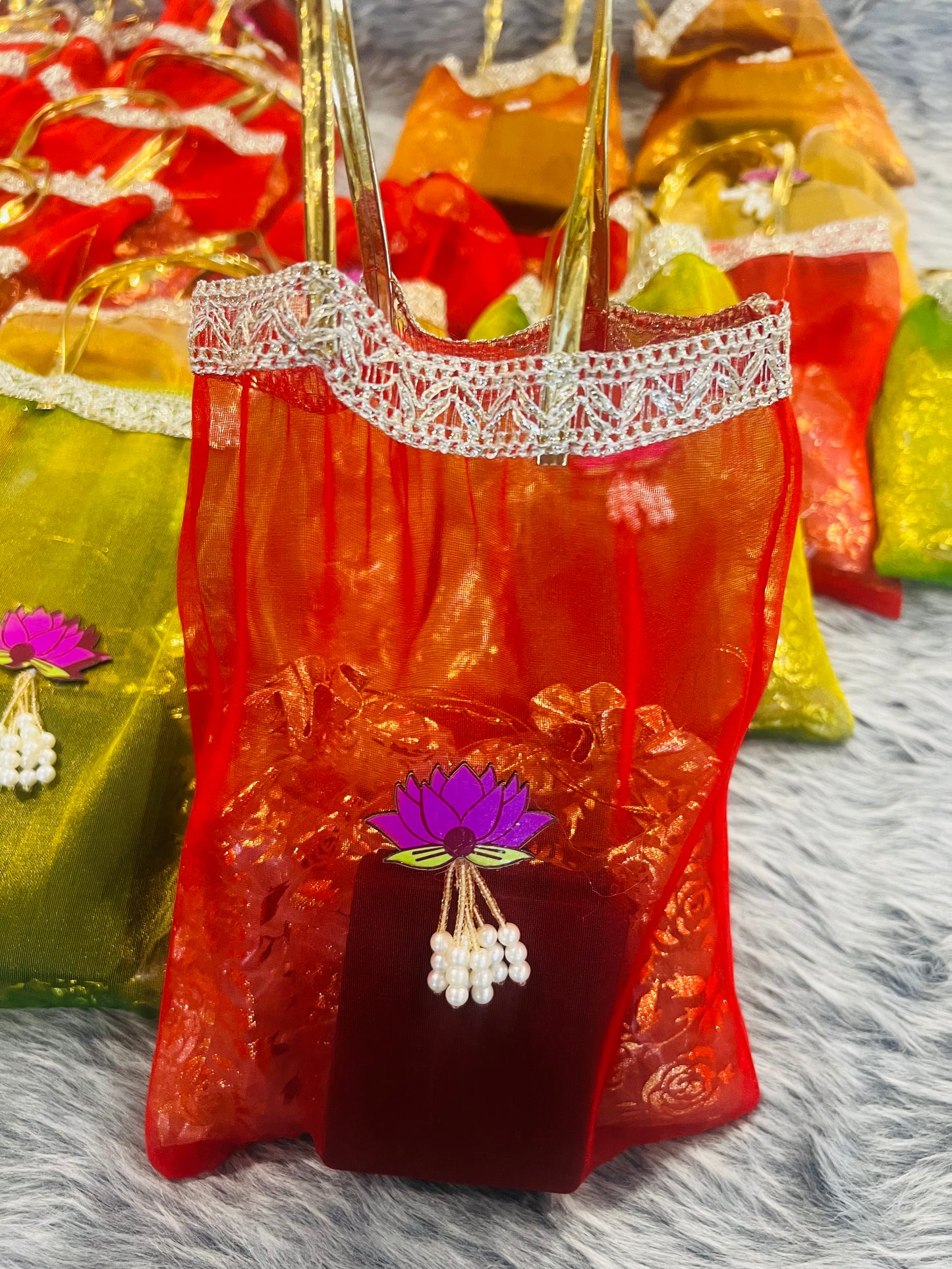 Premium Return Gift Hamper with Almonds, Raisins, Silver Polished Laxmi Charan Paduka in Lotus Decorated Tissue Bag