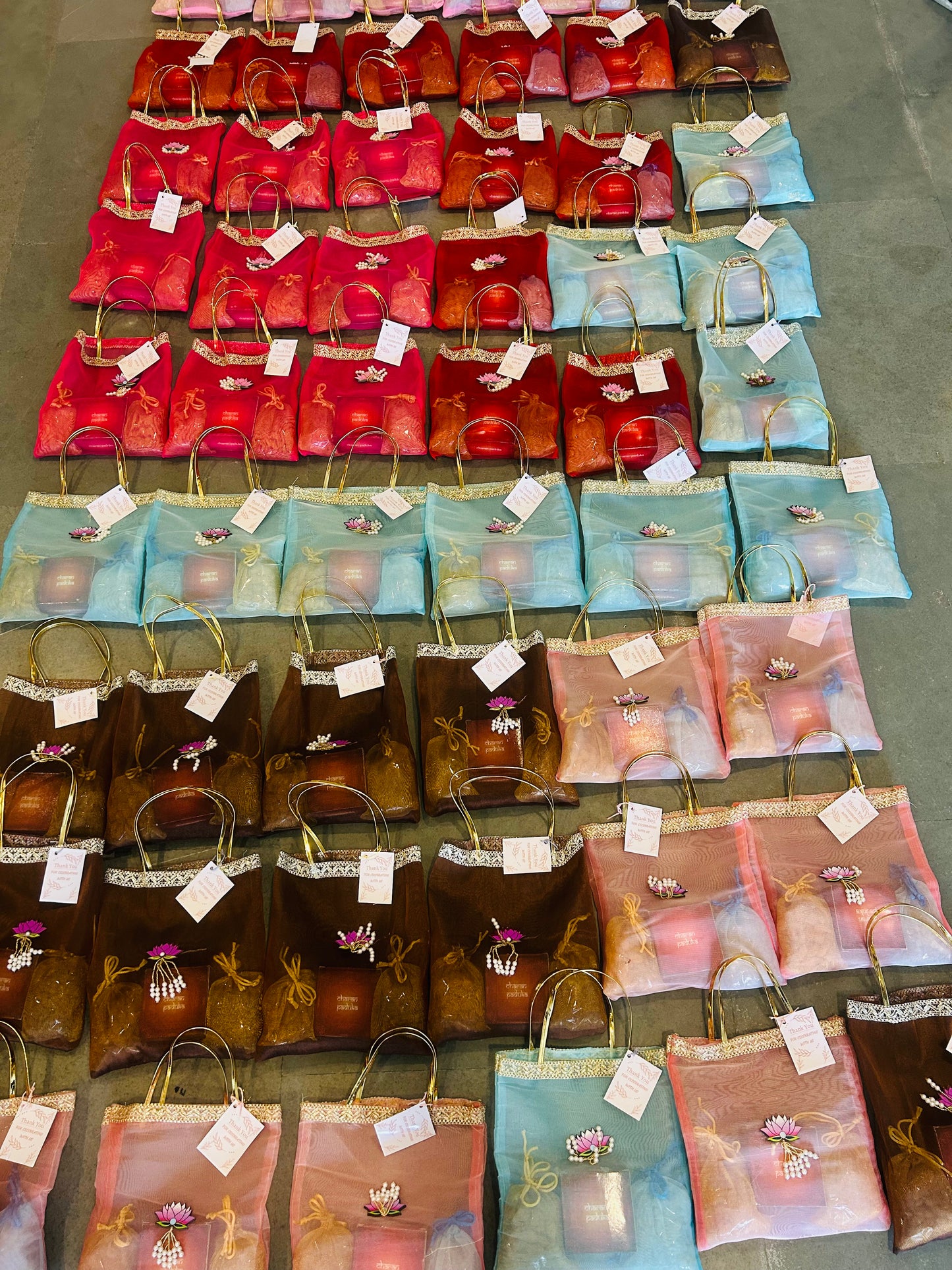 Premium Return Gift Hamper with Almonds, Raisins, Laxmi Charan Paduka Gift Box in Lotus Decorated Tissue Bag