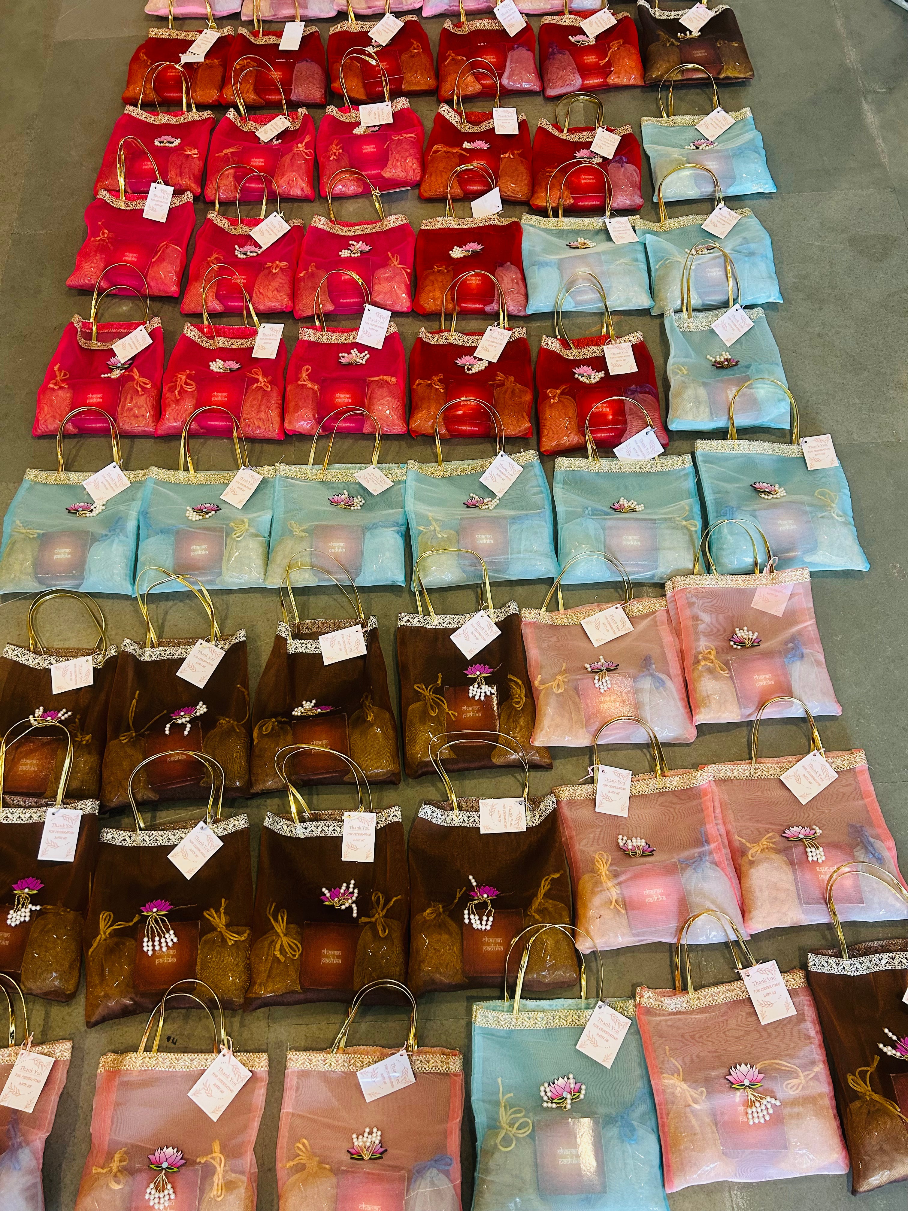 Premium Return Gift Hamper with Almonds, Raisins, Laxmi Charan Paduka Gift Box in Lotus Decorated Tissue Bag