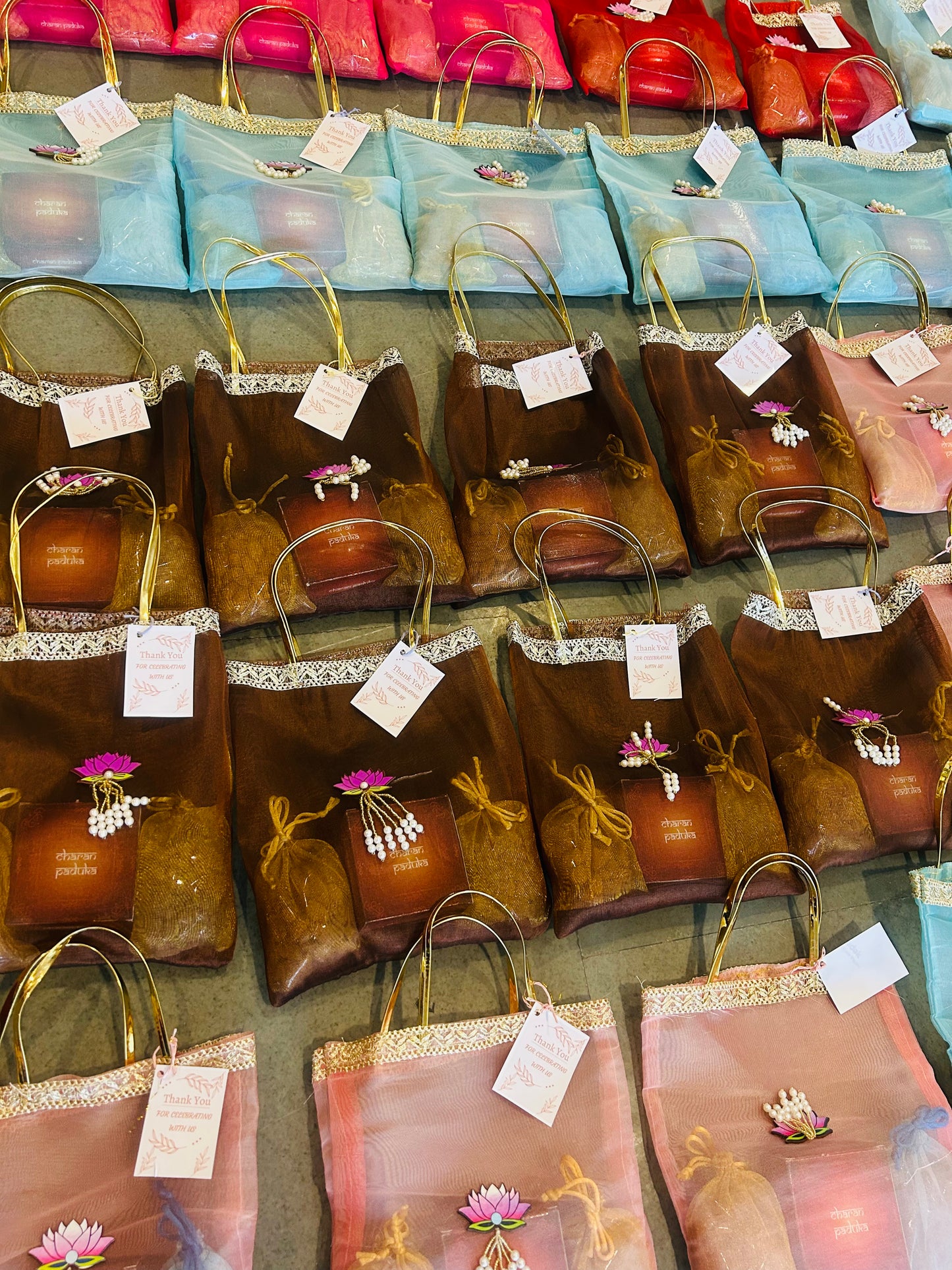 Premium Return Gift Hamper with Almonds, Raisins, Laxmi Charan Paduka Gift Box in Lotus Decorated Tissue Bag