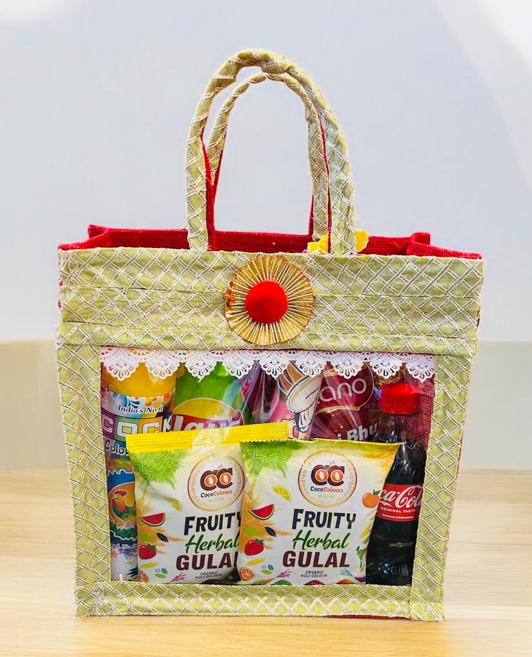 Holi hamper with colorful gulal, snacks, and snow spray in a decorative jute bag
