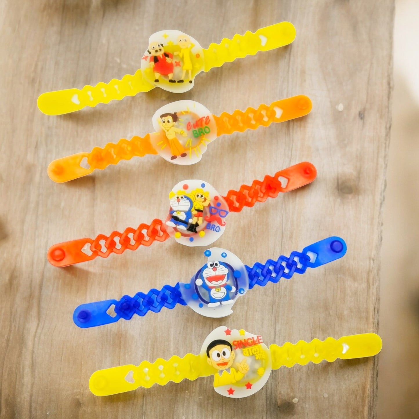 Wrap Shap Kids Rakhi - Multi Characters Light Rakhi (A) with Doremon, Motu Patlu, Pikachu & More, Comes with Roli Chawal