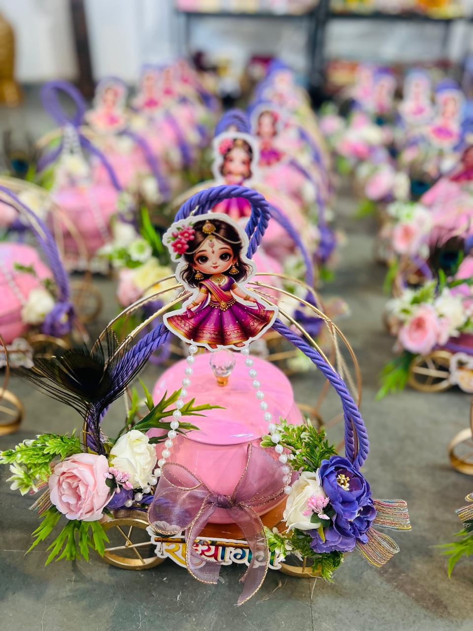 Radha Rani themed baby girl return gift cart with rasgulla jar for newborn announcement and first birthday