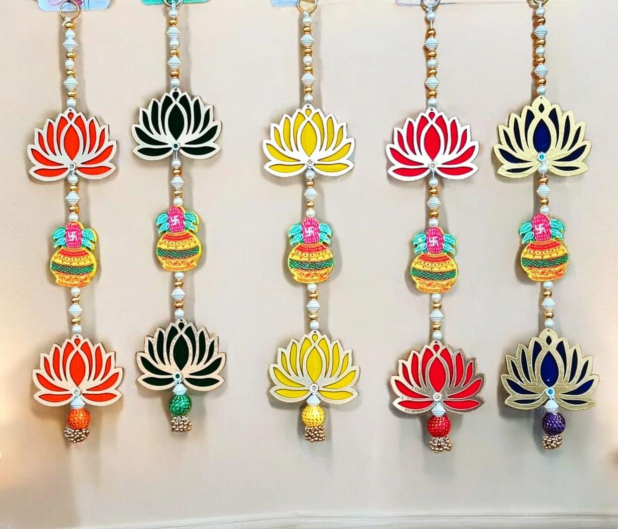 Traditional wooden kalash and lotus wall hanging