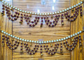 Traditional rudraksha bead toran with bells