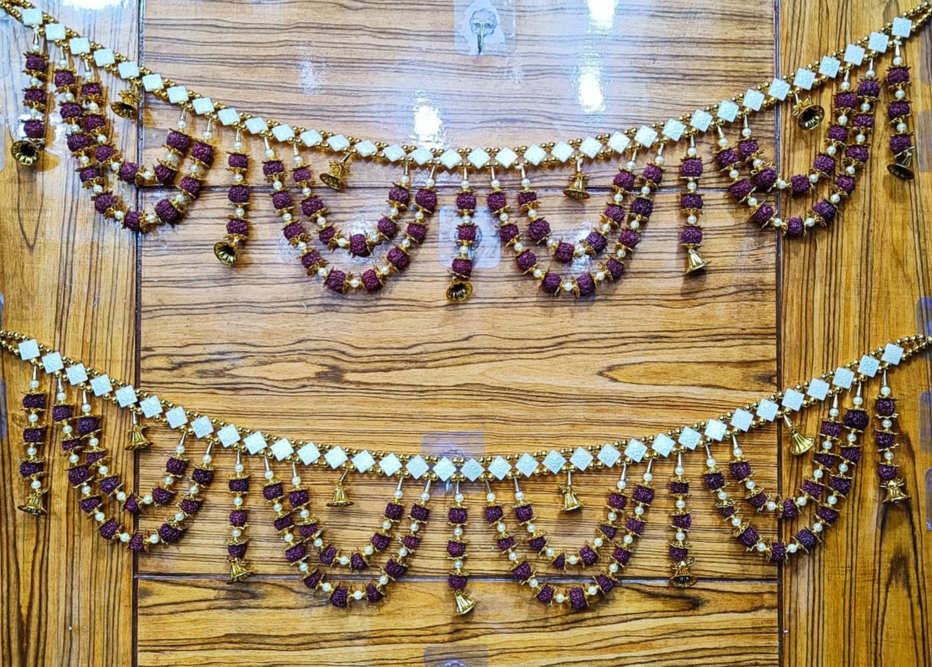Traditional rudraksha bead toran with bells