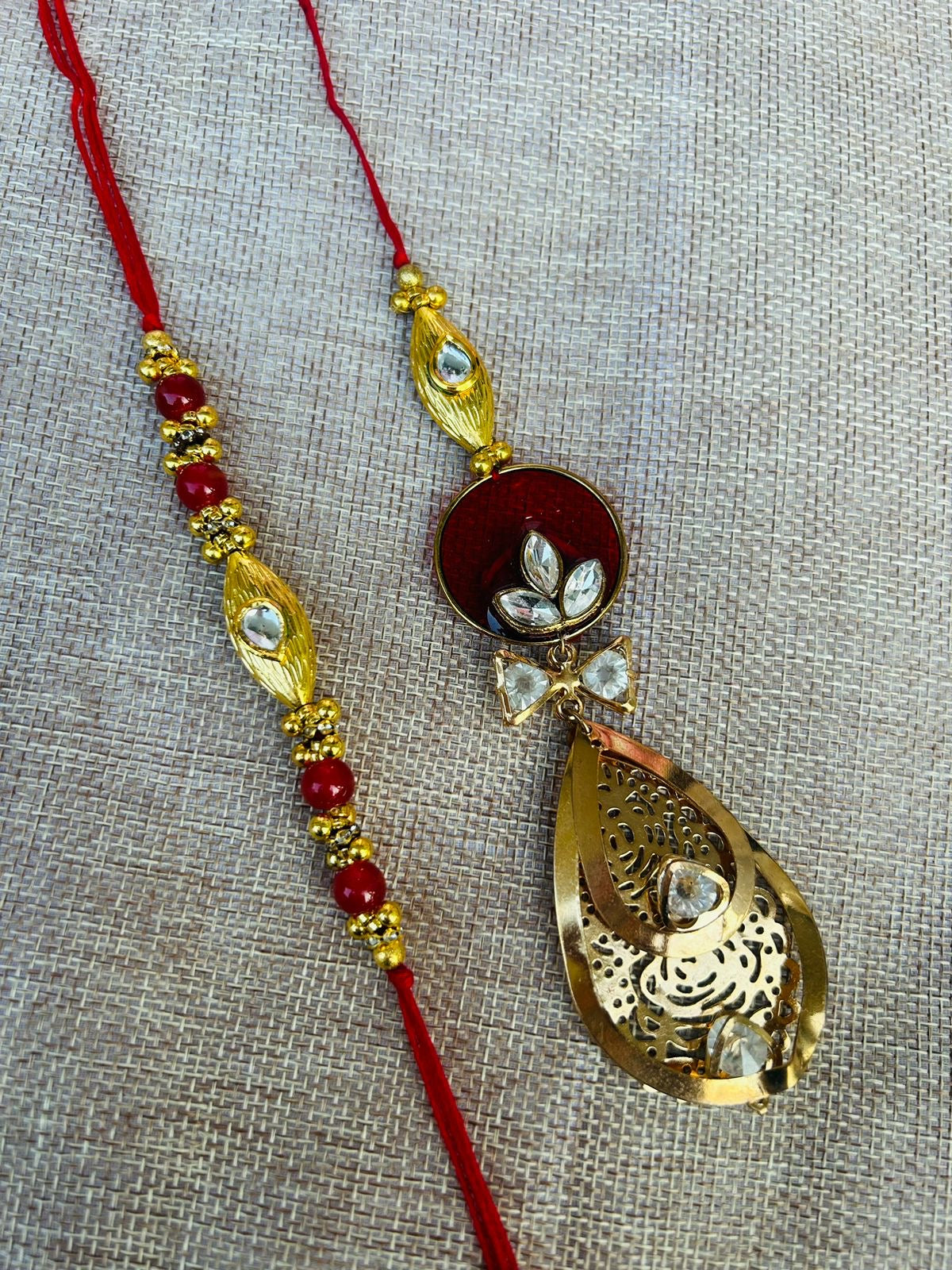 Wrap Shap P29 Bhaiya Bhabhi Rakhi Lumba Set – Red & Green Resin Stone with Kundan Design