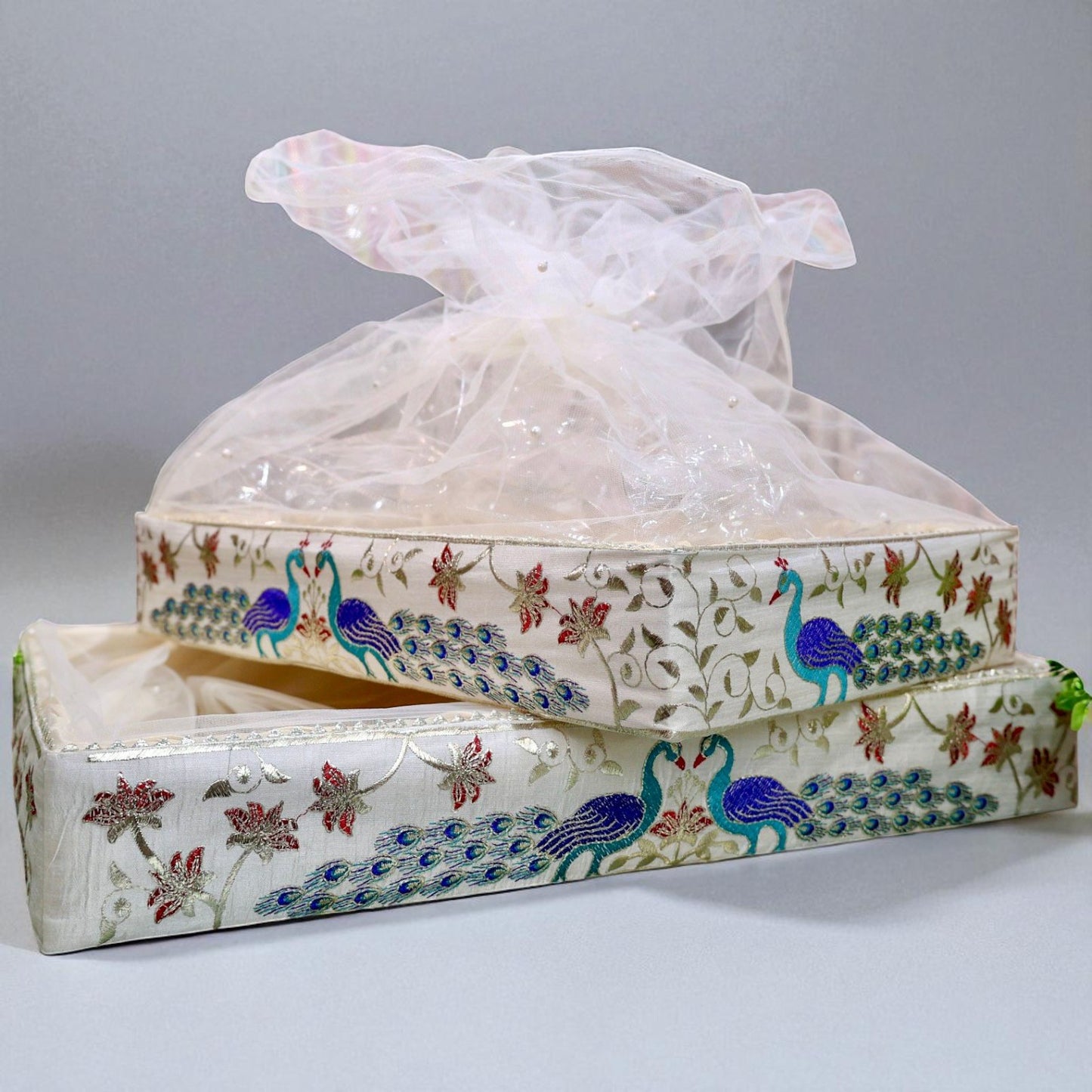 Rectangular peacock handle hamper basket with net cover by Wrap Shap for premium festive and wedding gift arrangements