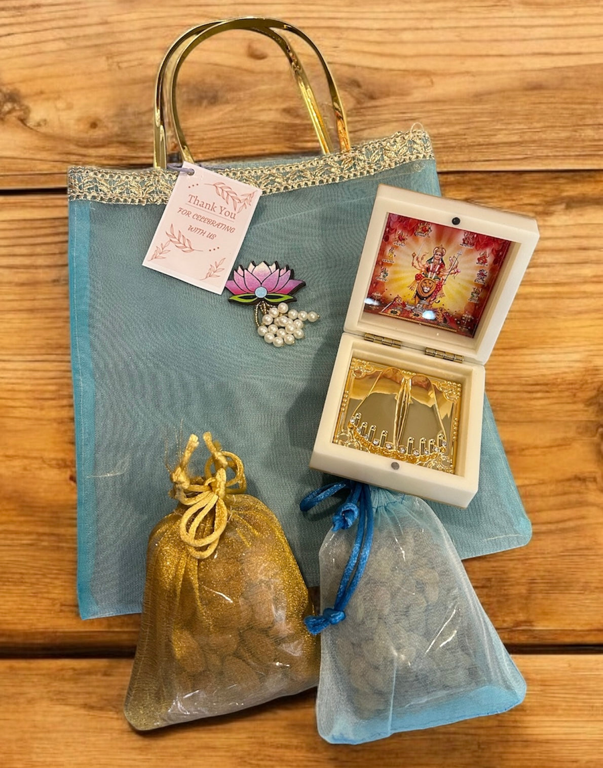 Premium Return Gift Hamper with Almonds, Raisins, Laxmi Charan Paduka Gift Box in Lotus Decorated Tissue Bag