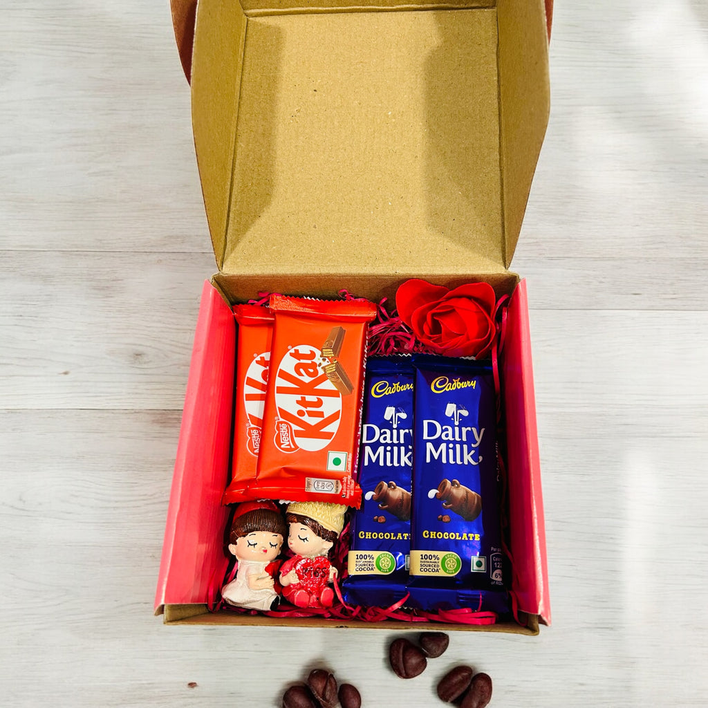 Romantic couple figurine with Dairy Milk & Kit Kat chocolates in a stylish gift box for Valentine’s Day, anniversary, or wedding gifts.