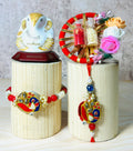 Peacock embroidered Bhaiya Bhabhi rakhi lumba set with kundan stone work and festive red threads by Wrap Shap