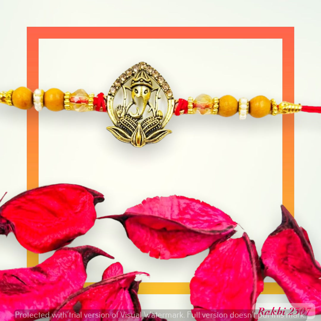 Wrap Shap 2307 Ganeshji on Lotus Metal Rakhi – Divine Blessings with Roli Chawal