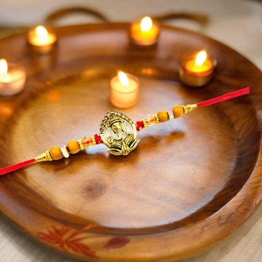 Wrap Shap 2307 Ganeshji on Lotus Metal Rakhi – Divine Blessings with Roli Chawal