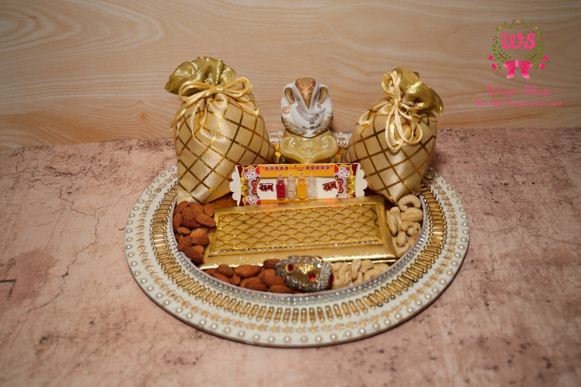 Buy family Rakhi hamper with Bhaiya Bhabhi Rakhi, dry fruits, Ganpati, & pooja thali. Send rakhi to India. Bulk Rakhi gifts from Wrap Shap.