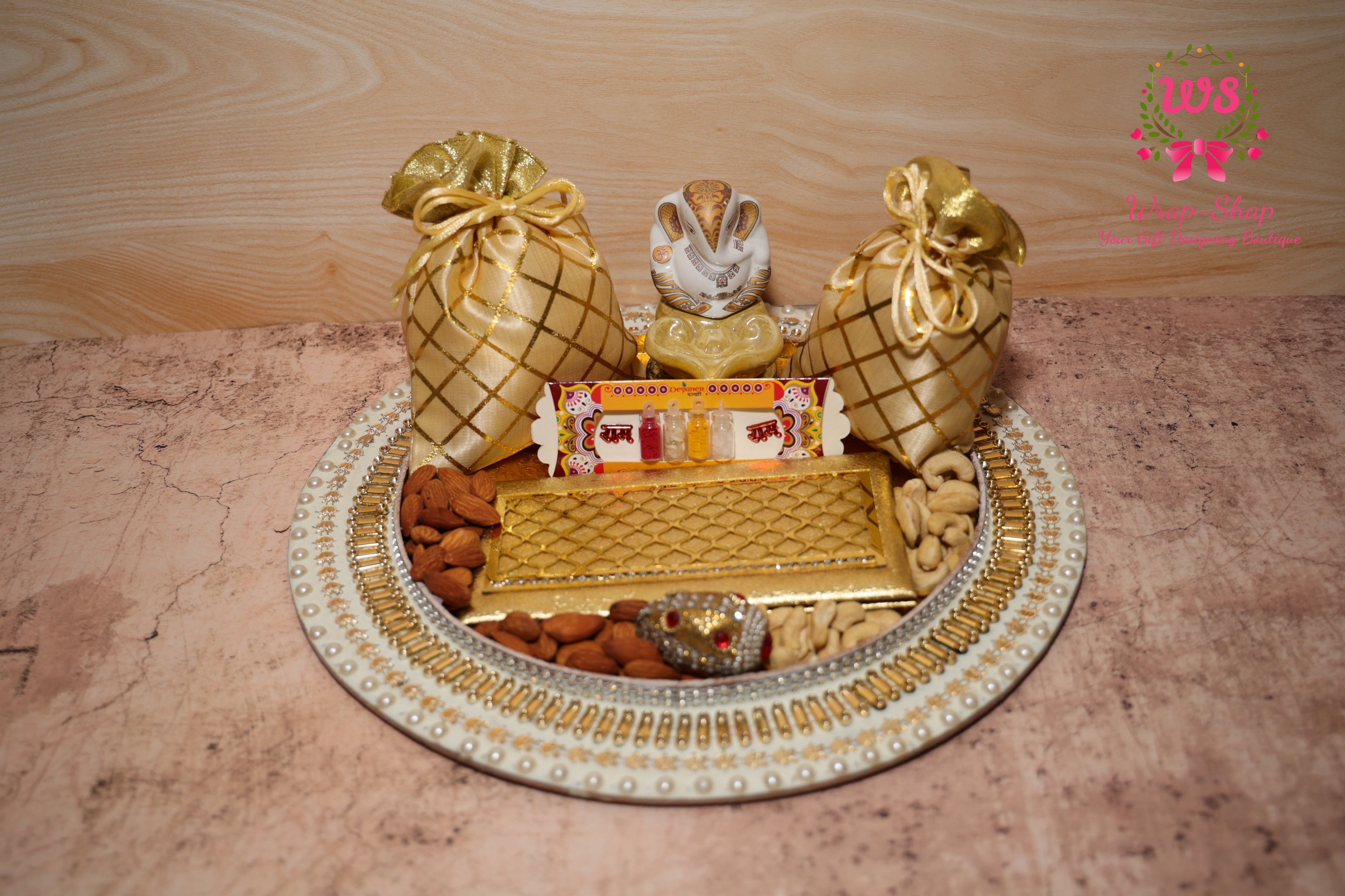 Buy family Rakhi hamper with Bhaiya Bhabhi Rakhi, dry fruits, Ganpati, & pooja thali. Send rakhi to India. Bulk Rakhi gifts from Wrap Shap.