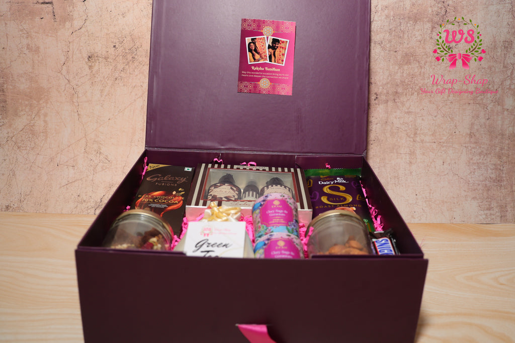 Luxury Bhaiya Bhabhi Rakhi Gift Hamper with Love Co Body Care, Dry Fruits, Candles, Chocolates & Personalized Photo Tag | Wrap Shap