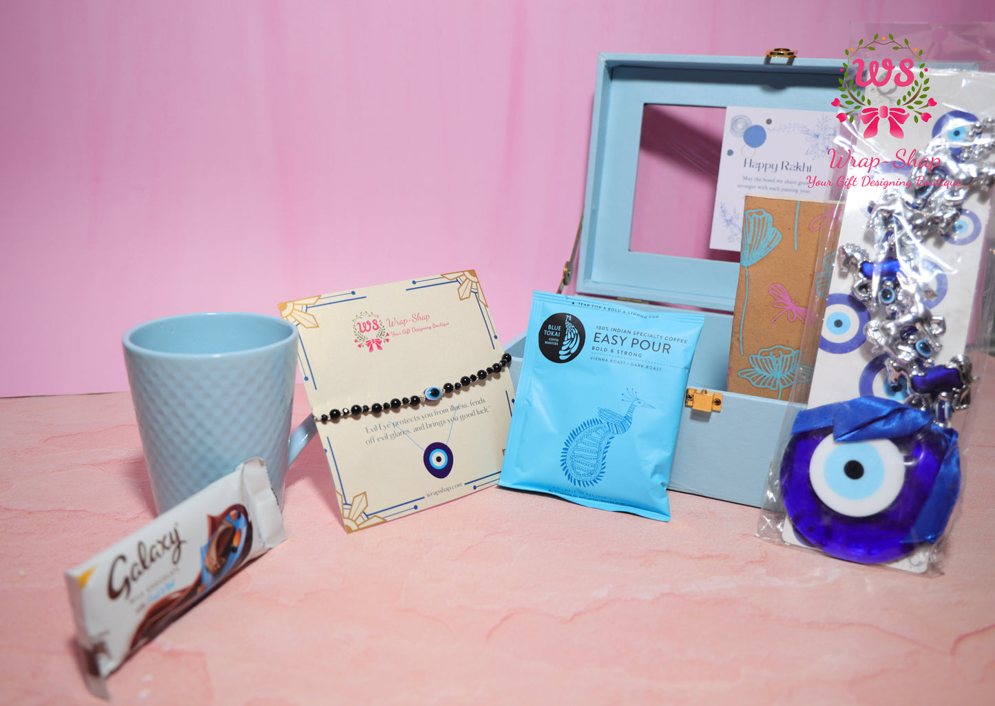 Evil Eye Rakhi Hamper with Blue Coffee Mug, Blue Tokai Coffee, Notebook, Chocolate & Rakhi in Blue MDF Gift Box | Wrap Shap