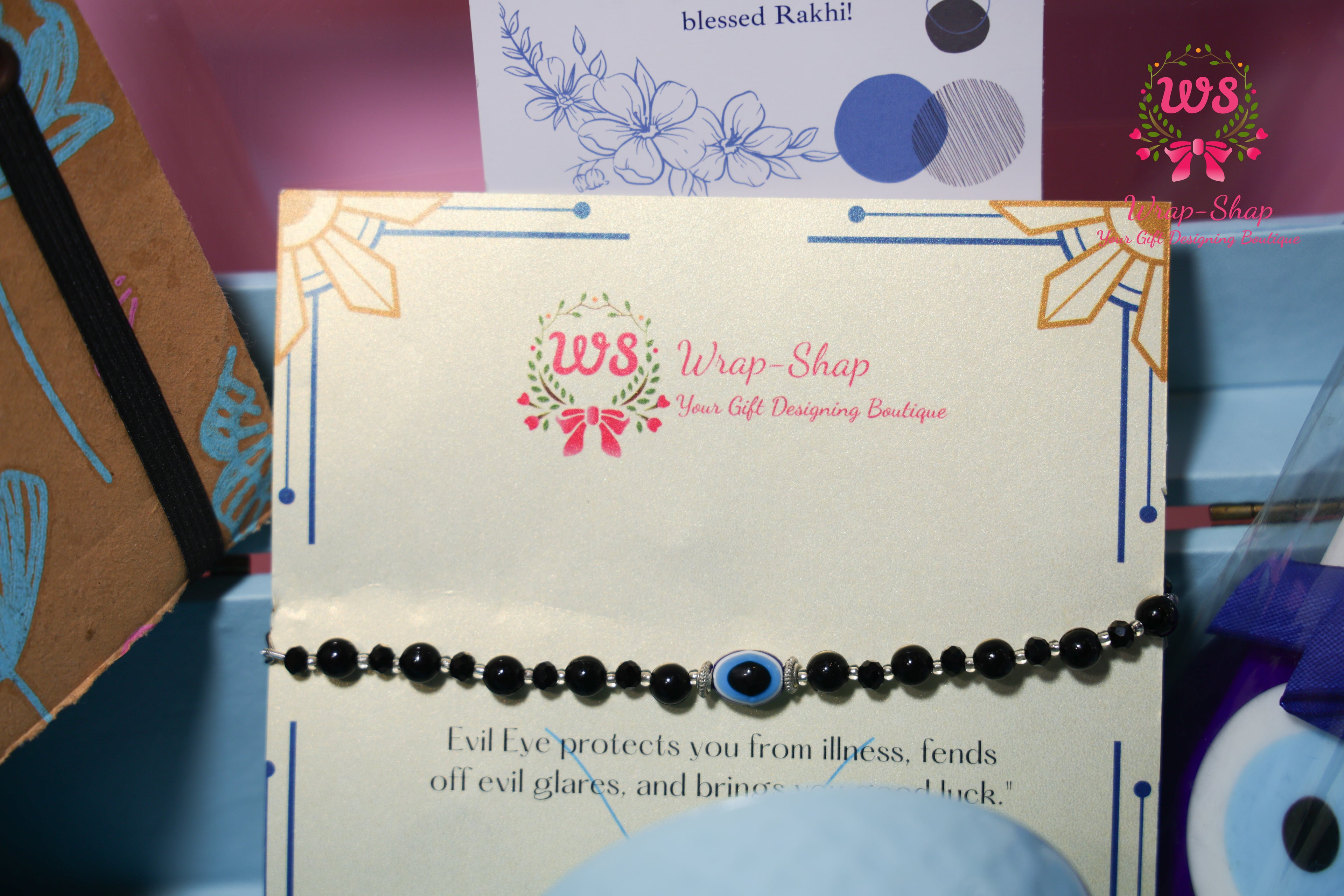 Evil Eye Rakhi Hamper with Blue Coffee Mug, Blue Tokai Coffee, Notebook, Chocolate & Rakhi in Blue MDF Gift Box | Wrap Shap