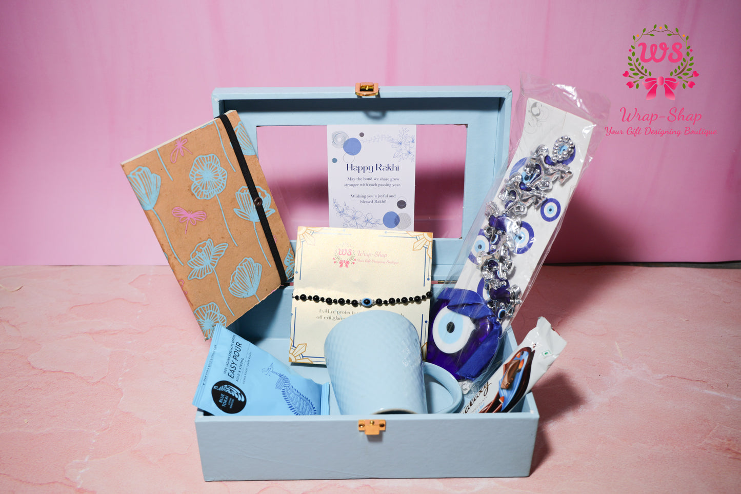 Evil Eye Rakhi Hamper with Blue Coffee Mug, Blue Tokai Coffee, Notebook, Chocolate & Rakhi in Blue MDF Gift Box | Wrap Shap