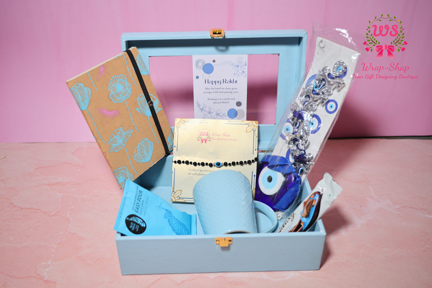 Evil Eye Rakhi Hamper with Blue Coffee Mug, Blue Tokai Coffee, Notebook, Chocolate & Rakhi in Blue MDF Gift Box | Wrap Shap
