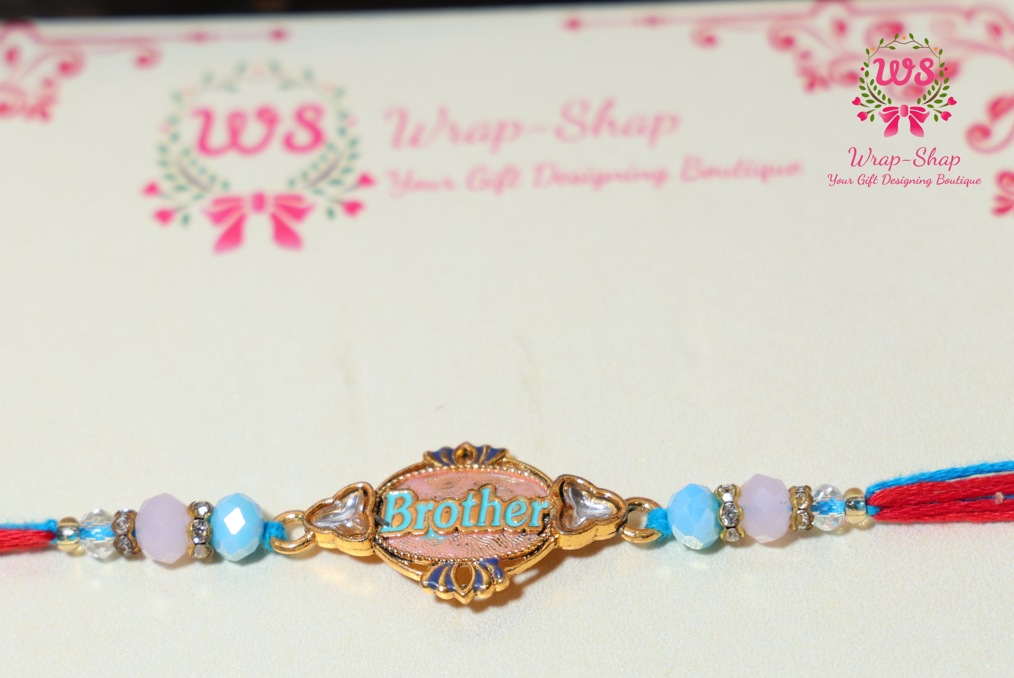 Gaming Rakhi Hamper with Boat Earpods, Korean Noodles, Energy Drink & Football Keychain in Rigid Gift Box | Wrap Shap