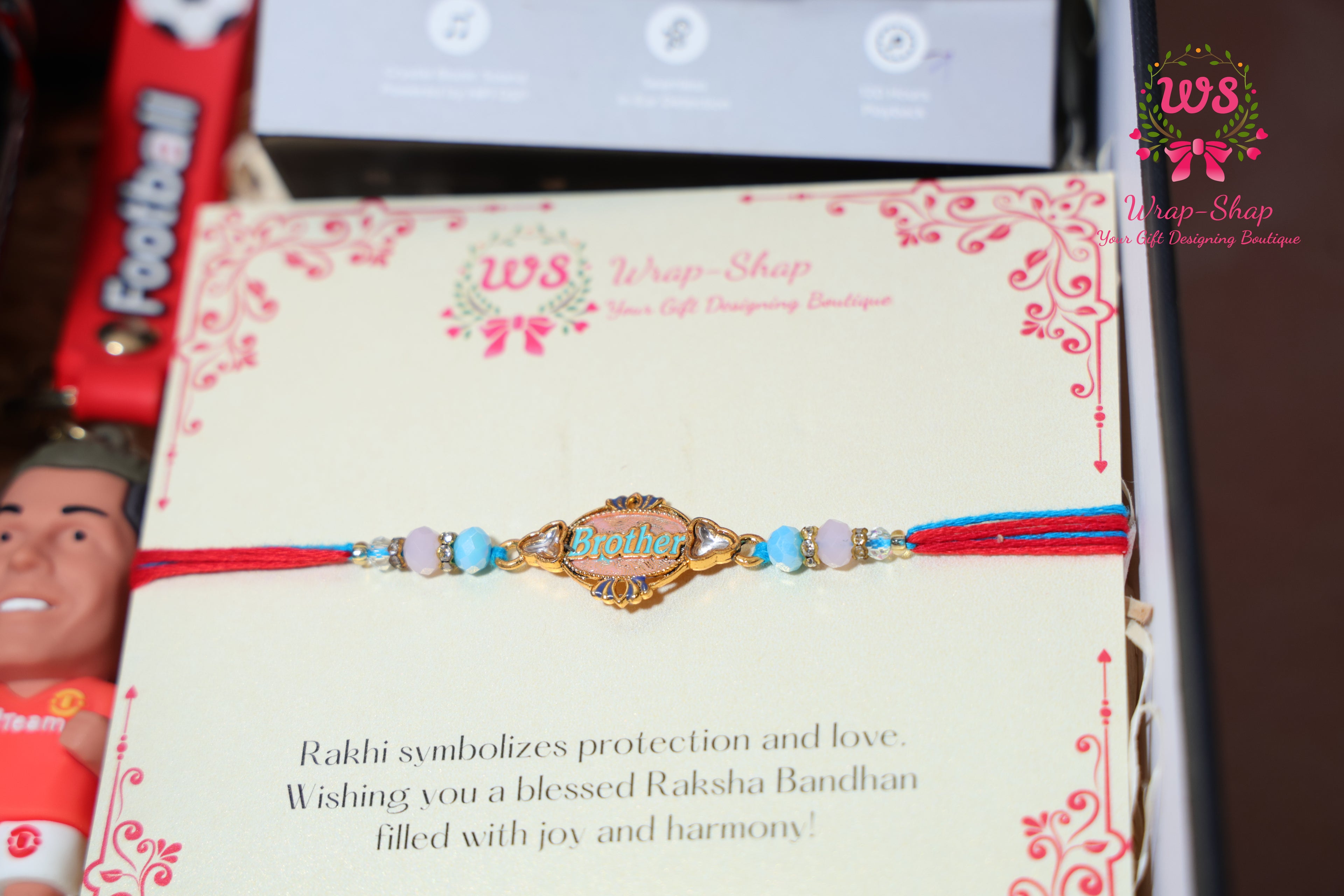 Gaming Rakhi Hamper with Boat Earpods, Korean Noodles, Energy Drink & Football Keychain in Rigid Gift Box | Wrap Shap