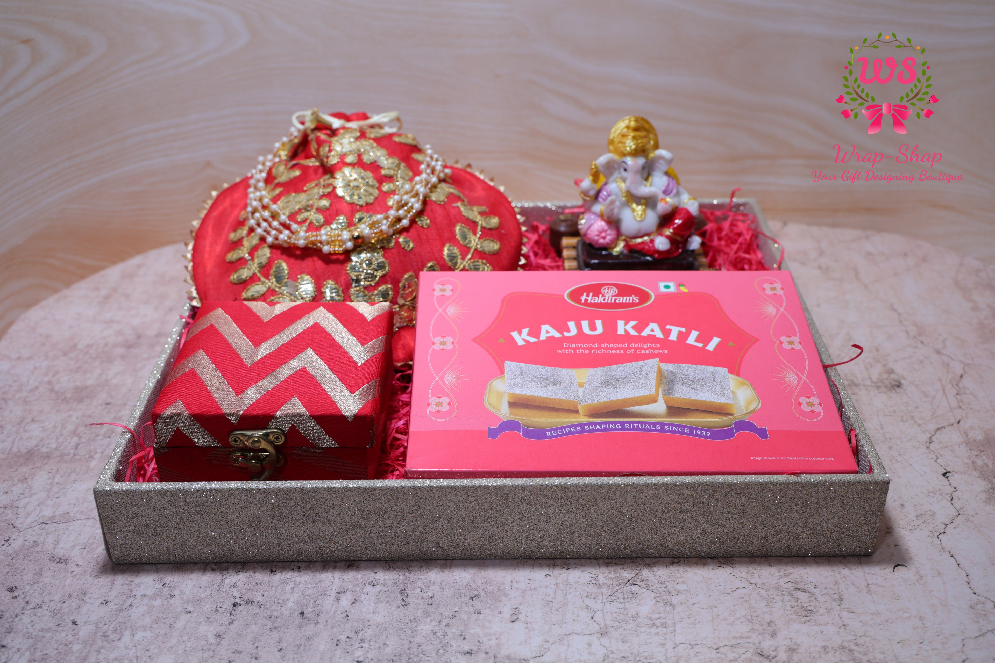 Bhaiya Bhabhi Rakhi Gift Hamper with Kaju Katli, Ganpati Idol, Potli & Tray | Raksha Bandhan Gift Box by Wrap Shap