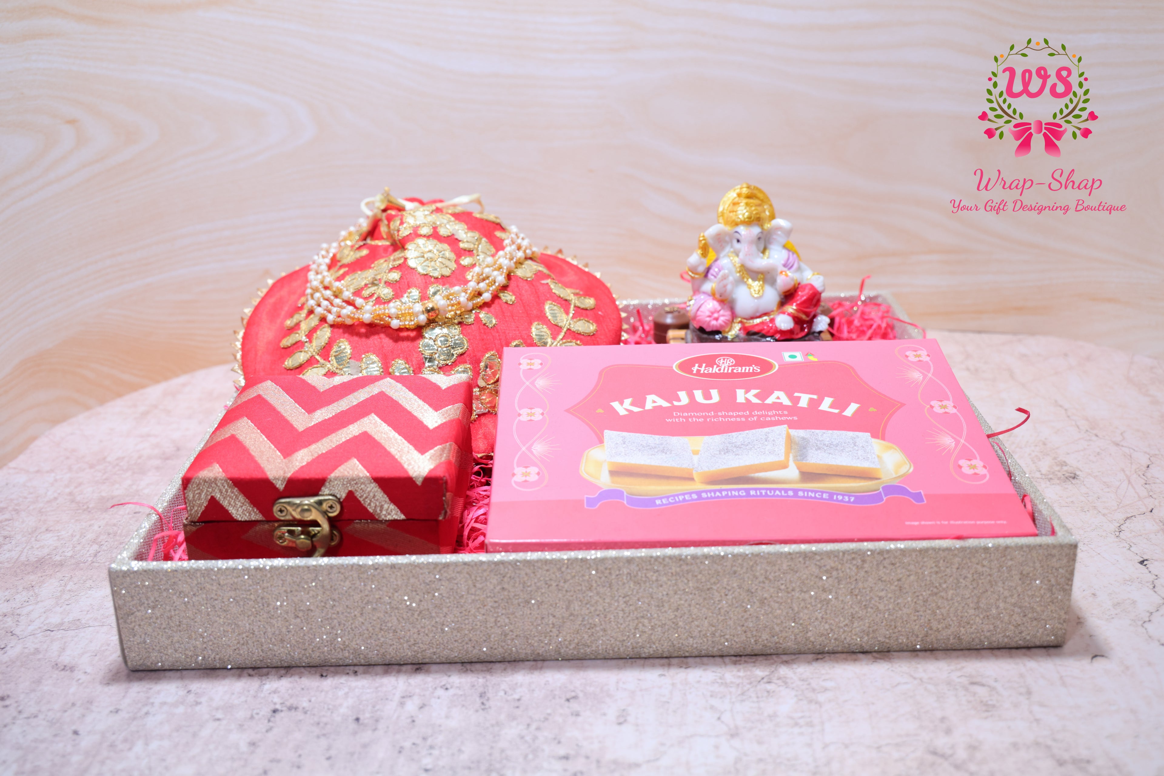 Bhaiya Bhabhi Rakhi Gift Hamper with Kaju Katli, Ganpati Idol, Potli & Tray | Raksha Bandhan Gift Box by Wrap Shap