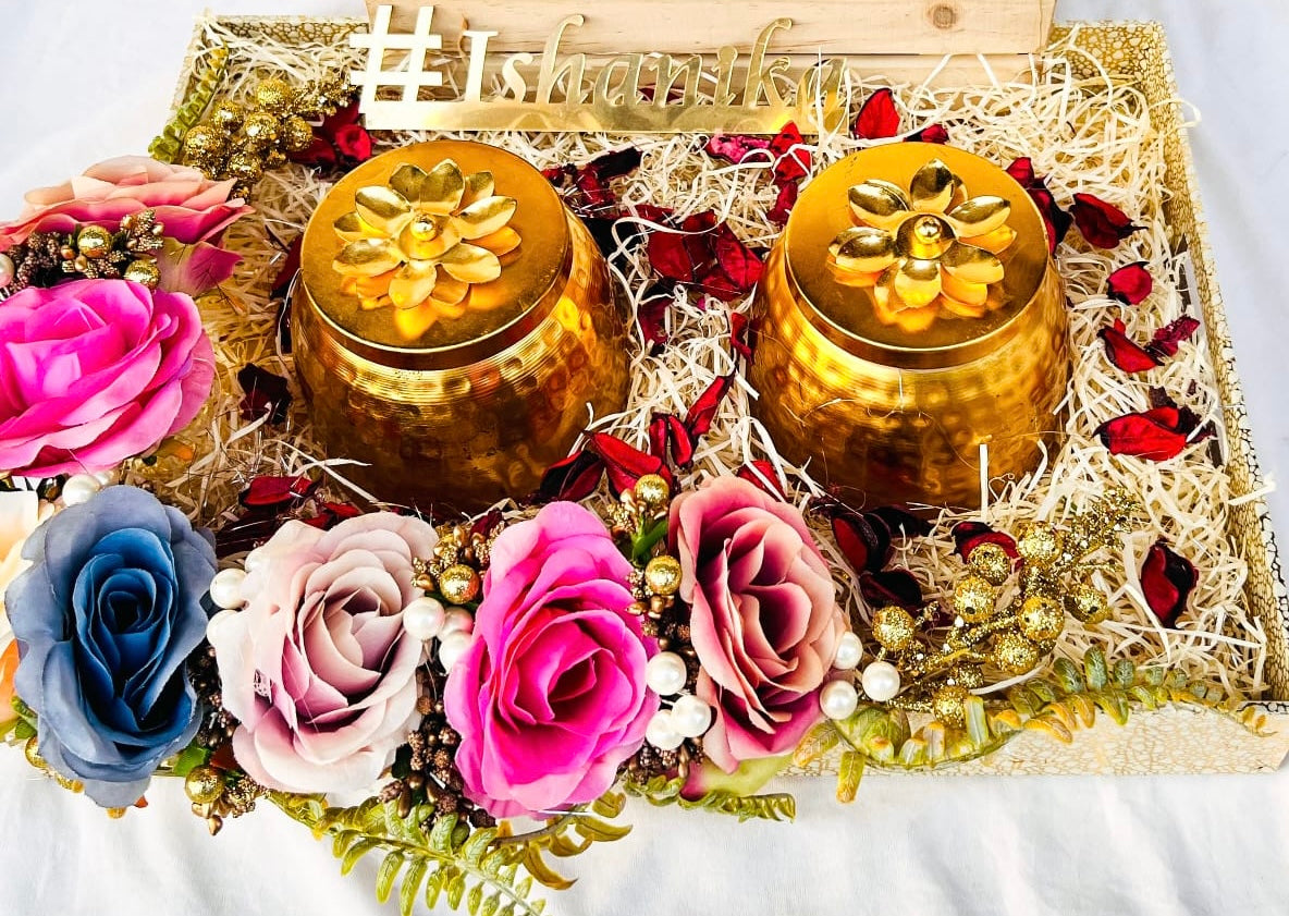 Wrap Shap invitation platter with big rose border, two metal jars with dry fruits, acrylic hashtag, and decorative backwall on a wooden base