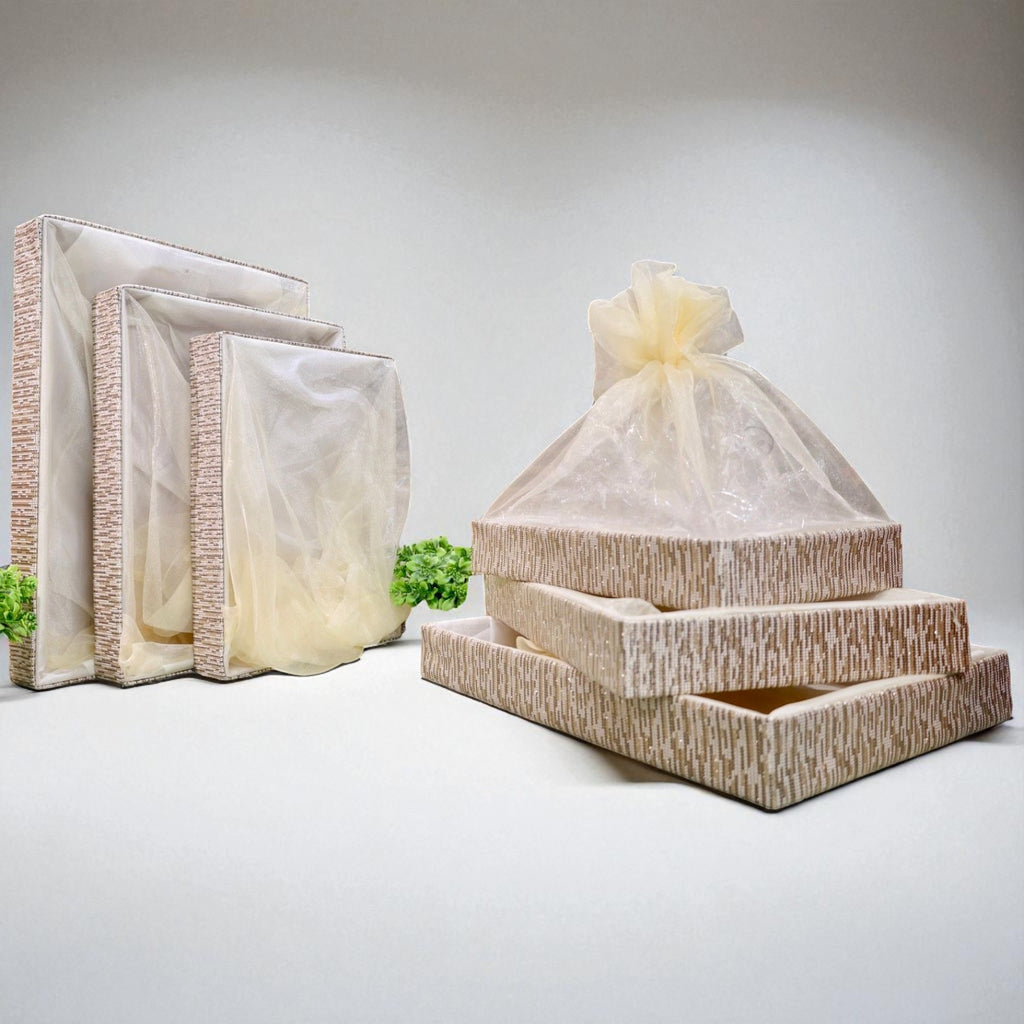 Set of shimmer net gift baskets in multiple sizes with artificial flowers on sides, ideal for festive hampers and trousseau packing by Wrap Shap