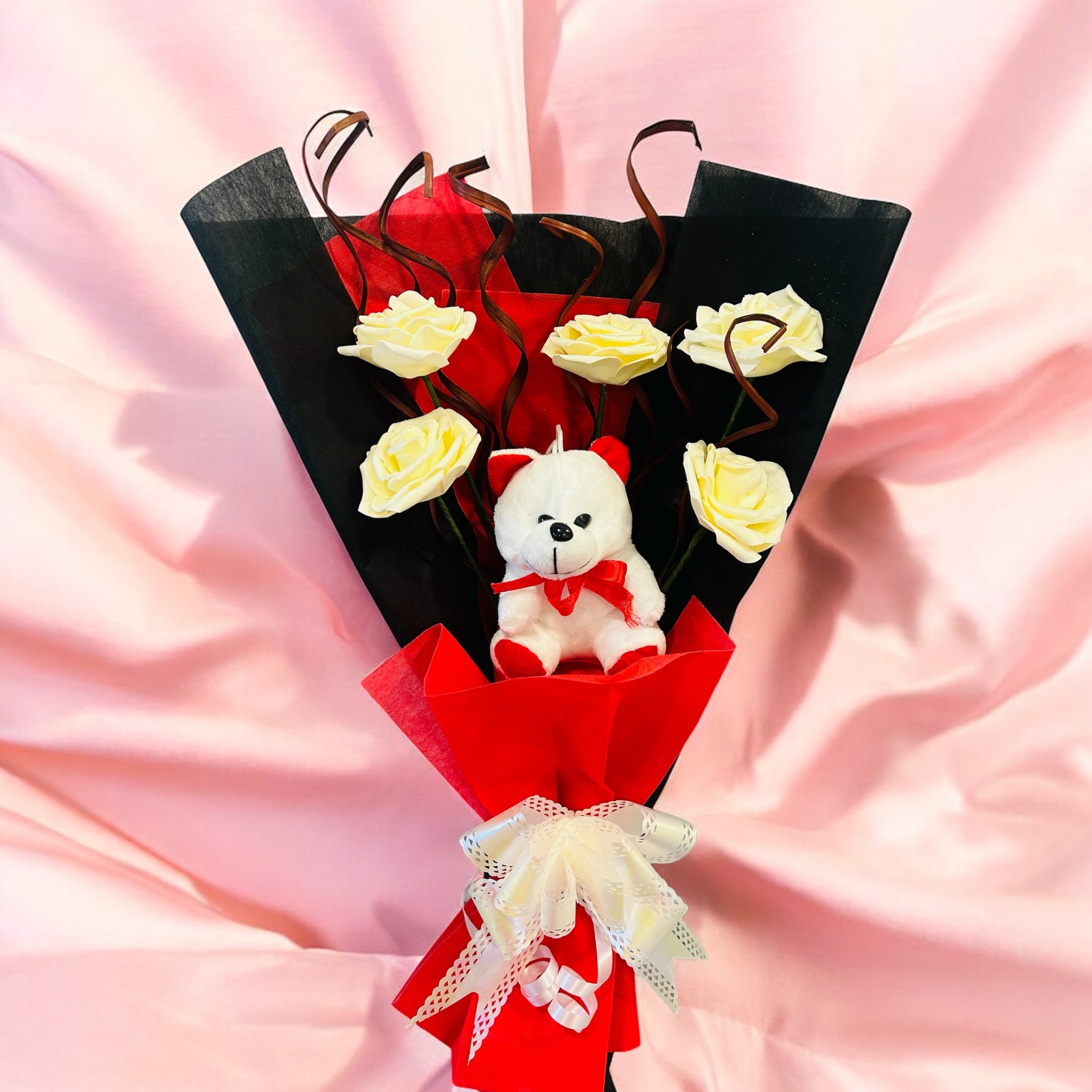 Beautiful teddy bear bouquet with artificial roses in a stylish gift arrangement for Valentine’s Day, anniversaries, birthdays, and wedding gifts.