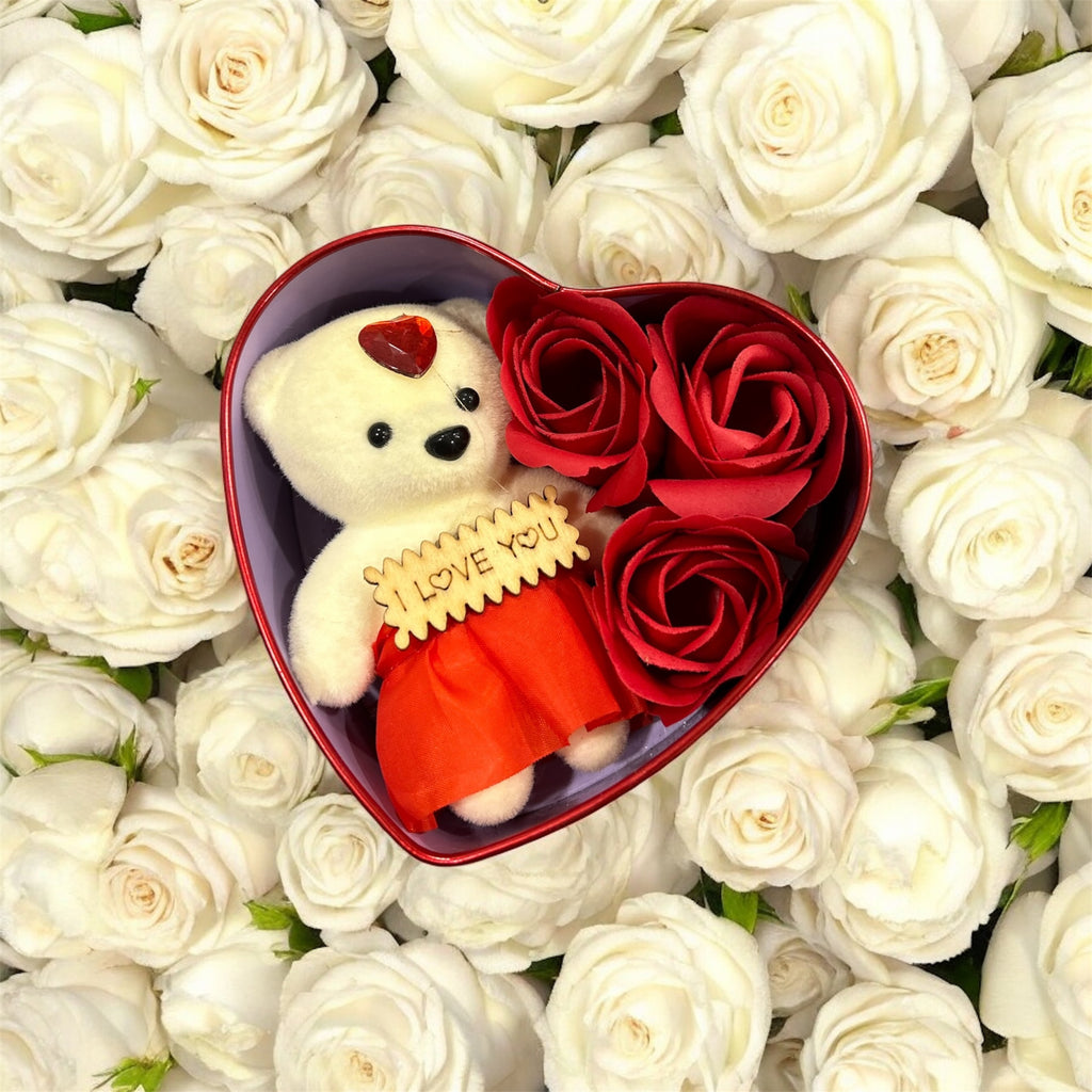Heart-shaped gift box with soft teddy bear and three artificial roses – perfect romantic Valentine’s, anniversary, or birthday gift.