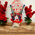 Love-themed transparent balloon hamper with a teddy bear and chocolates, perfect for romantic occasions like Valentine’s Day, anniversaries, and weddings.