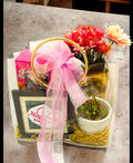 Elegant gift set with a personalized photo frame, jade plant, diffuser, chocolates, and artificial plant in a transparent PVC bag – perfect for all occasions.