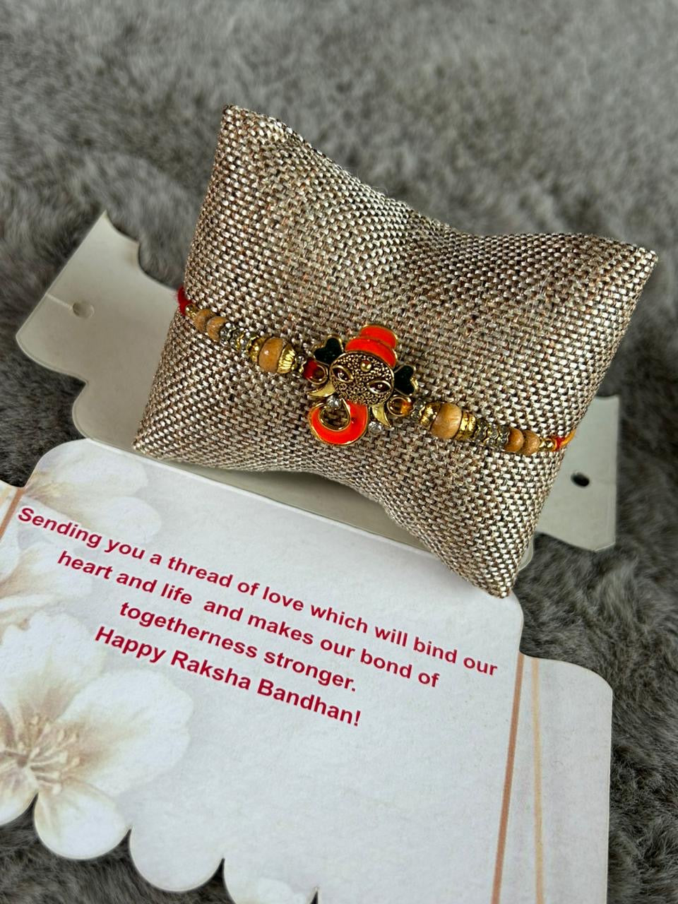 Wrap Shap Orange Ganesh Rakhi - Model Z17 with Roli Chawal