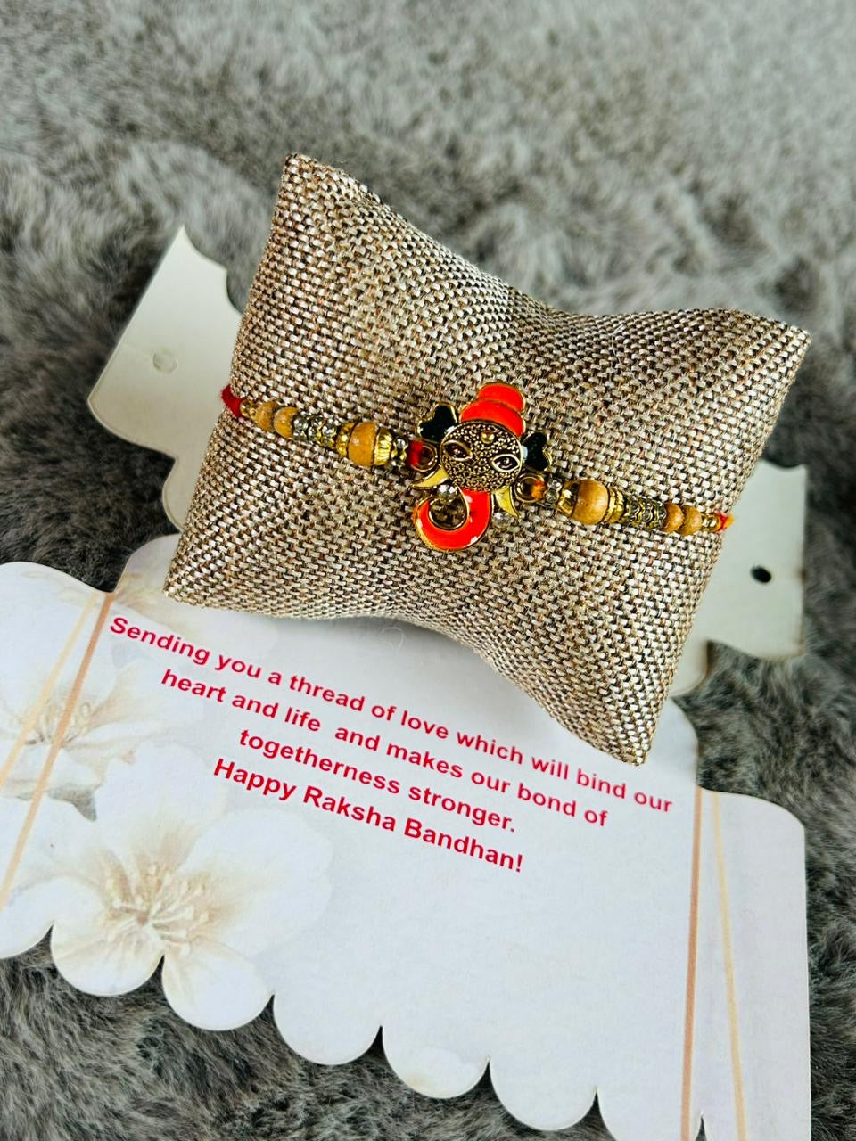 Wrap Shap Orange Ganesh Rakhi - Model Z17 with Roli Chawal