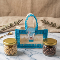 Baby boy return gift hamper in blue jute bag with makhana and chocolate almonds jar