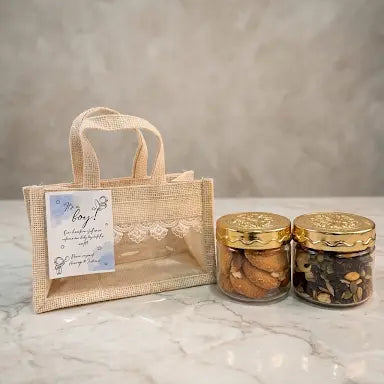 baby shower return gift hamper with cookies jar and dry fruit mix in jute bag