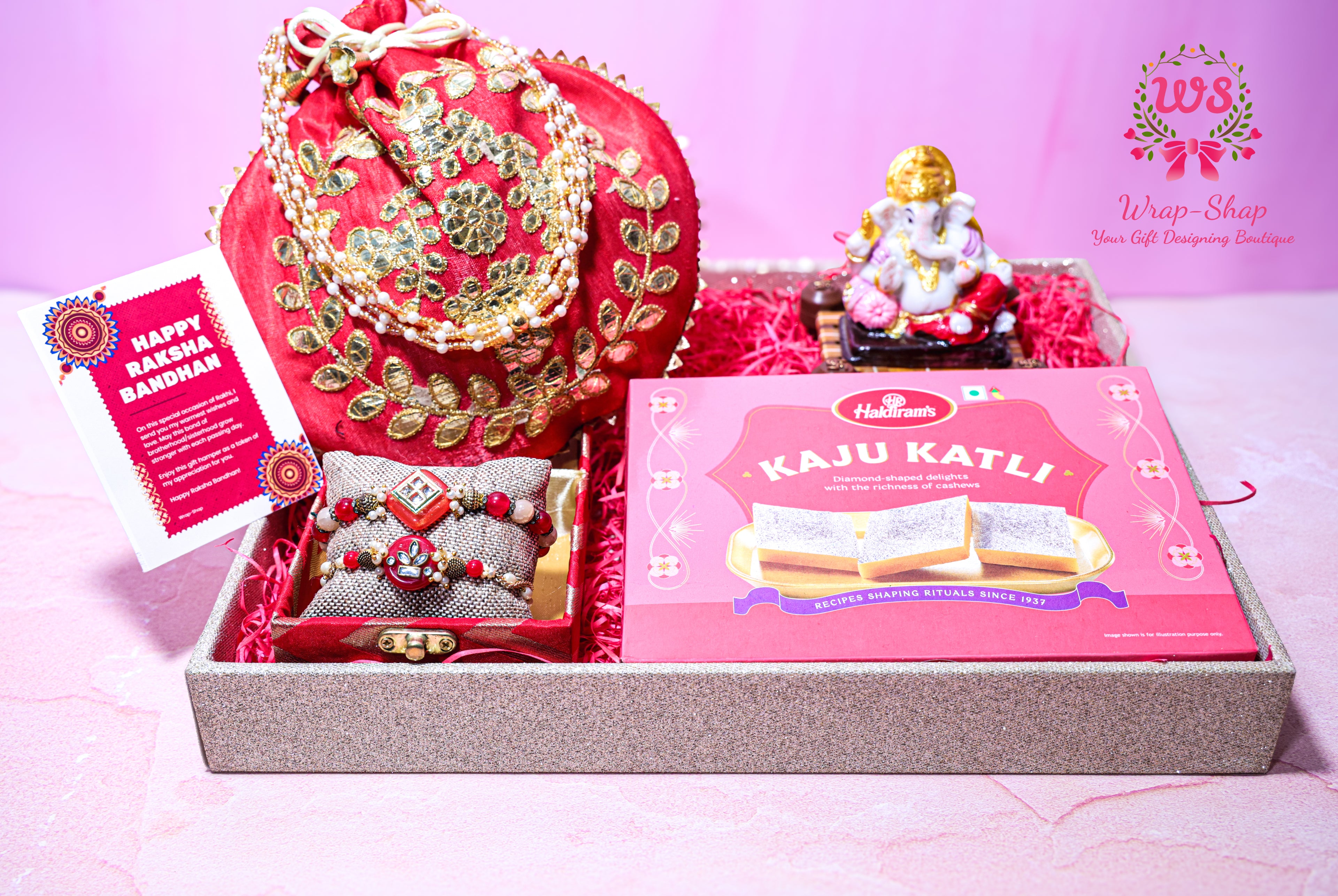 Wrap Shap Bhaiya Bhabhi Rakhi gift hamper with Kaju Katli, Ganpati idol, Lumba Rakhi set, potli bag and tray – Raksha Bandhan gifting