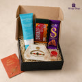 Premium Rakhi Grooming Starter Kit gift hamper for brother by Wrap Shap featuring a premium thread Rakhi, Engage pocket perfume, Dove & Key moisturiser, Cadbury chocolate, roli chawal, greeting card, and elegant gift box packaging for Raksha Bandhan.