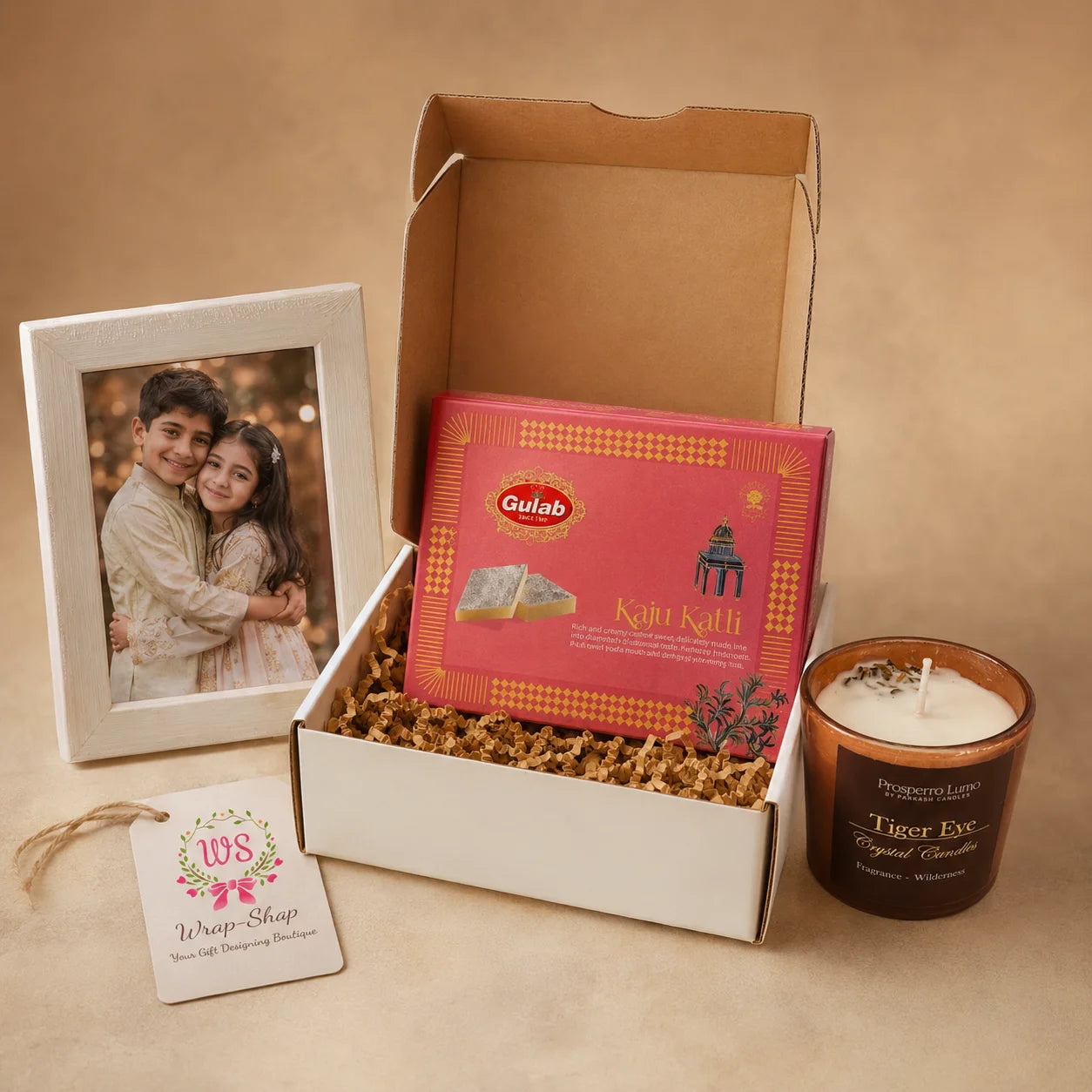 Candle & Memories Hamper by Wrap Shap featuring a scented candle, personalized photo frame, Kaju Katli, thank-you tag, and premium gift box packaging for Raksha Bandhan return gifting.