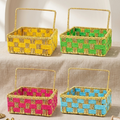 Four woven cotton rope baskets with handle in yellow, green, pink, and blue on a neutral background.