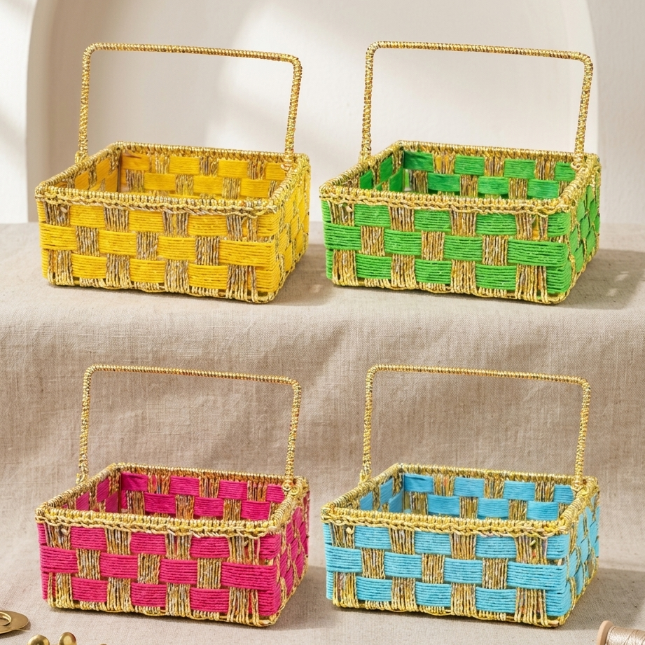 Four woven cotton rope baskets with handle in yellow, green, pink, and blue on a neutral background.