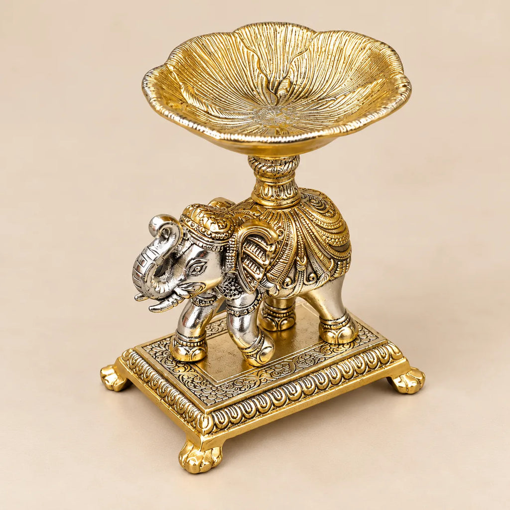 Decorative elephant diya stand with carved pedestal base
