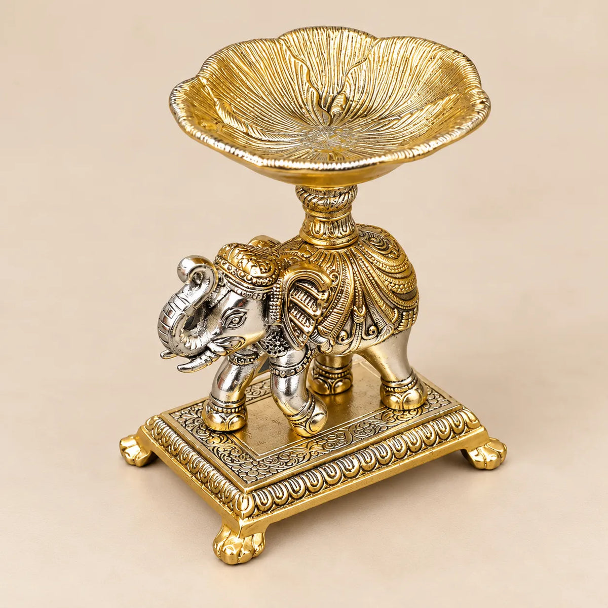 Decorative elephant diya stand with carved pedestal base