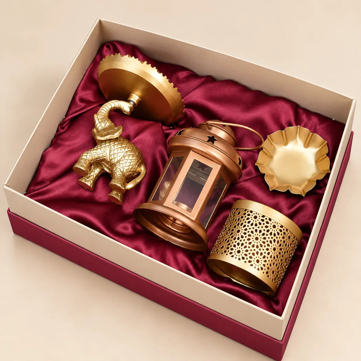 Regal elephant platter and lotus urli decorative gift set by Wrap Shap, premium metal décor gift set with elephant platter and lotus urli, festive metal gifting set for Diwali and corporate occasions, elephant-themed home décor gift set with decorative metal boxes, premium traditional Indian décor gift set for wedding and housewarming gifting.