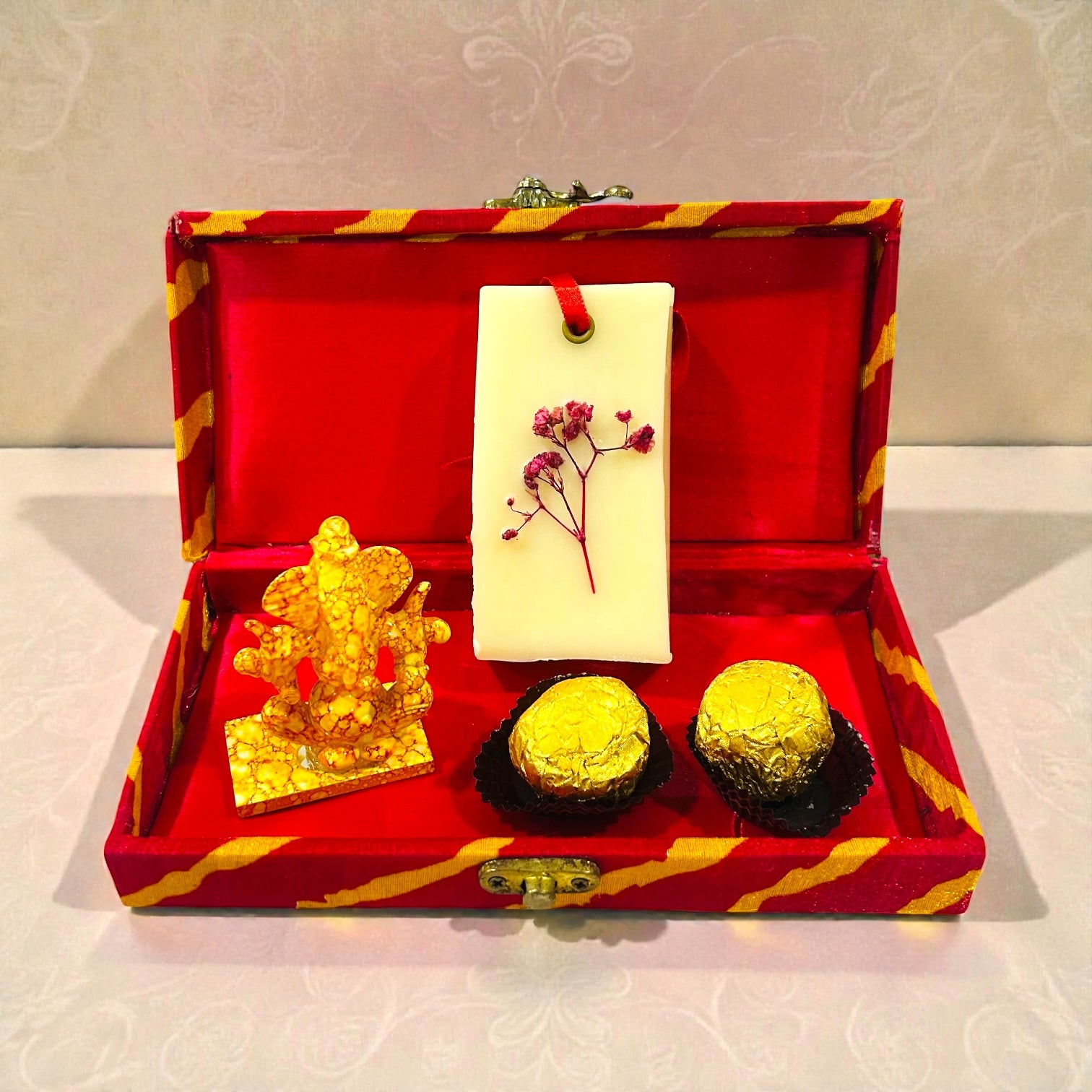 Wedding return favour with Ganesh statue, Ferrero Rocher chocolates and wax sachet in gift box