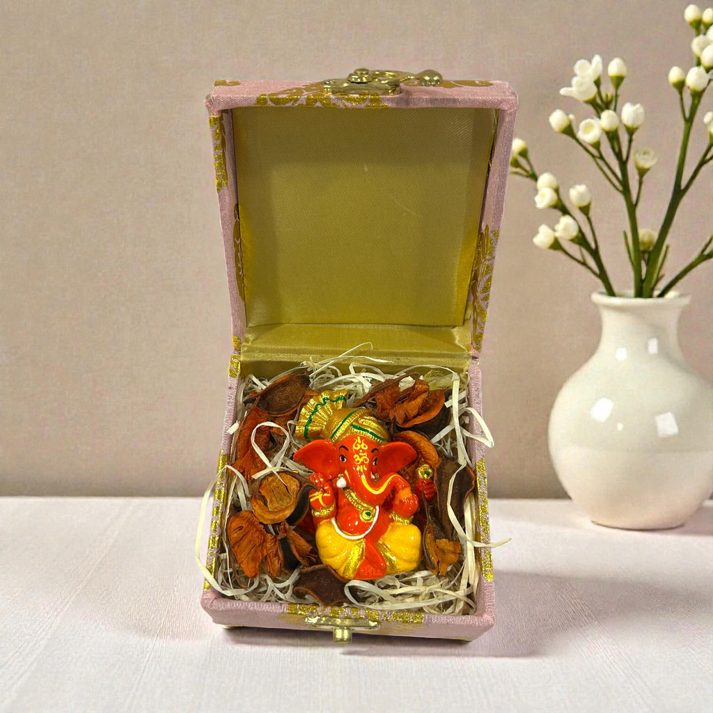 Wedding return favour with Ganesh Ji statue packed in a premium gift box.